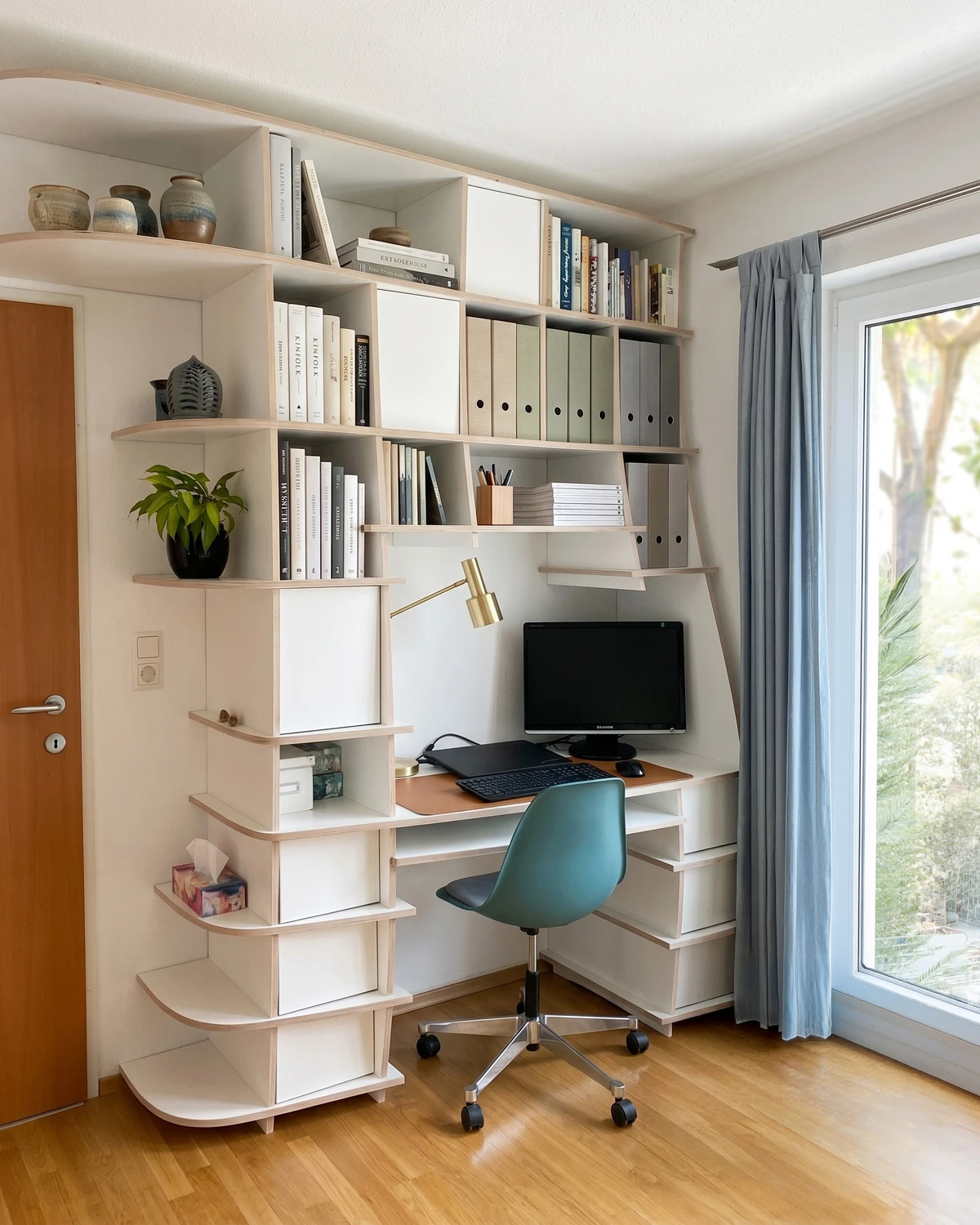 White shelf-and-desk combination in a corner